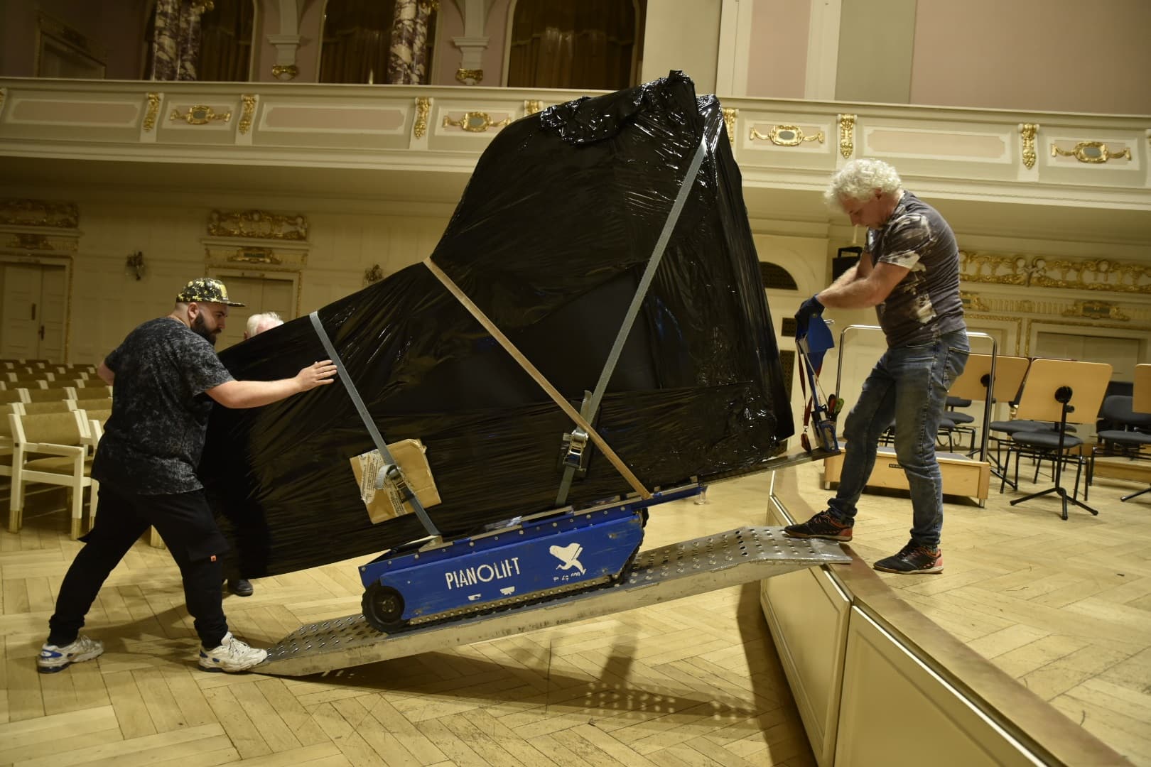Piano moving and careful relocation